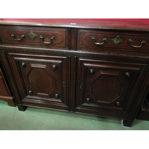 4041 - A 19th Century French pegged oak dresser base, the two drawers over a two door cupboard on stile fee... 