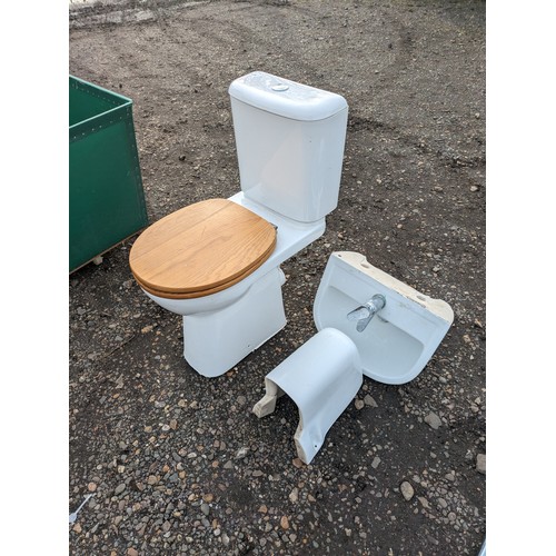 3519 - A ceramic toilet pan with cistern and hand basin