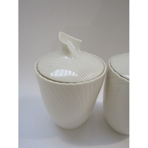 9061 - A pair of Belleek porcelain lidded canisters, c1980's mark, 23cm high