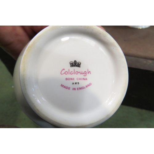 4006 - A Colclough bone china tea set, six bread and butter plates, cups, saucers, jug and bowls and a set ... 