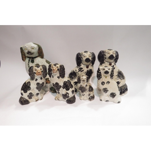 4012 - A pair of 19th Century black and white Staffordshire dogs, 20cm tall, a similar pair, 17cm tall, and... 