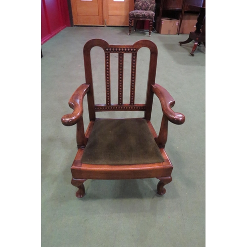 4018 - An Edwardian mahogany child's armchair with carved slatted back rest the scrolled end broad arms ove... 