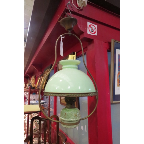 4021 - A French ceiling pendant oil lamp with opaque green glass shade