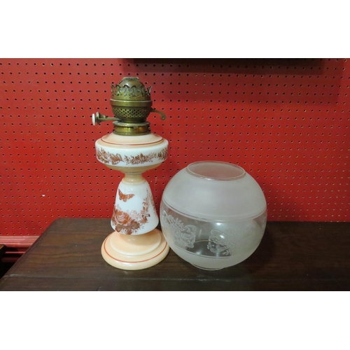4038 - A Victorian milk glass oil lamp with butterfly and floral design