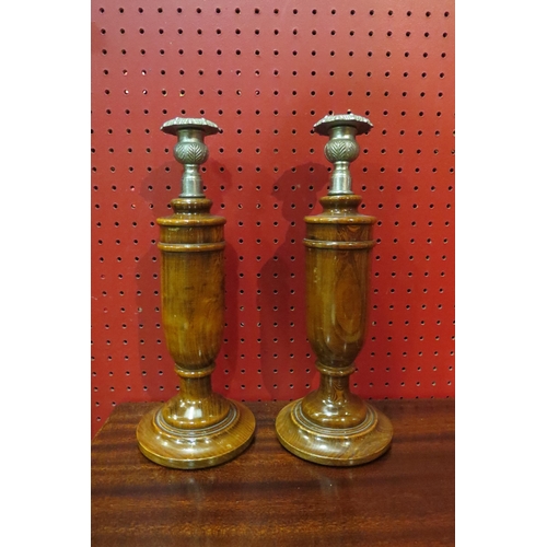 4080 - A pair of turned wood candlesticks with plated holders, 31cm tall