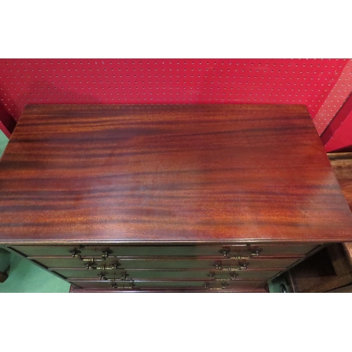 4083 - A George III style flame mahogany bachelor's chest the brushing slide over four graduating long draw... 