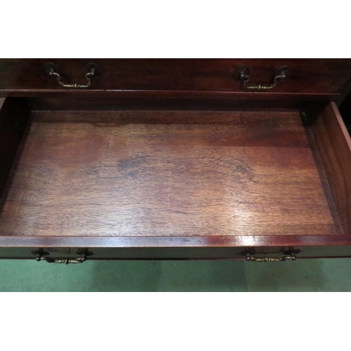 4083 - A George III style flame mahogany bachelor's chest the brushing slide over four graduating long draw... 