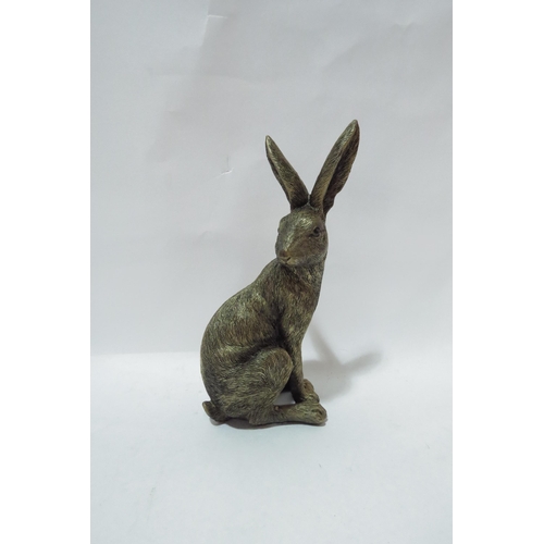 4097 - A resin bronze hare figure, 21cm tall