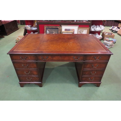 4107 - In the manner of Bevan & Funnell a George III style mahogany twin pedestal desk, the gilt tooled lea... 