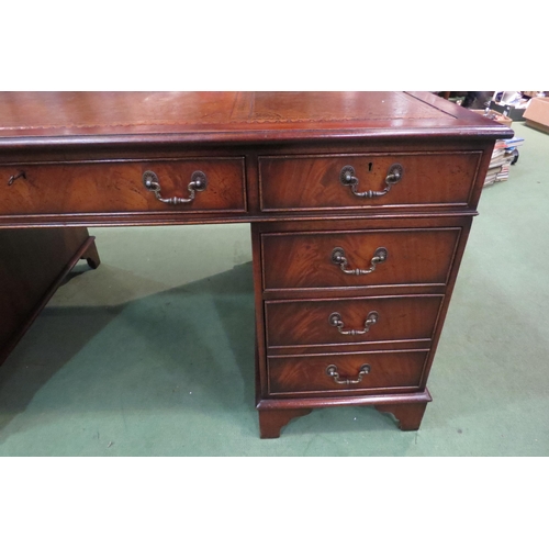 4107 - In the manner of Bevan & Funnell a George III style mahogany twin pedestal desk, the gilt tooled lea... 