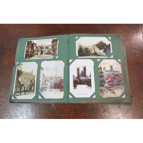 4109 - A postcard album with various contents including topographical, ships and churches