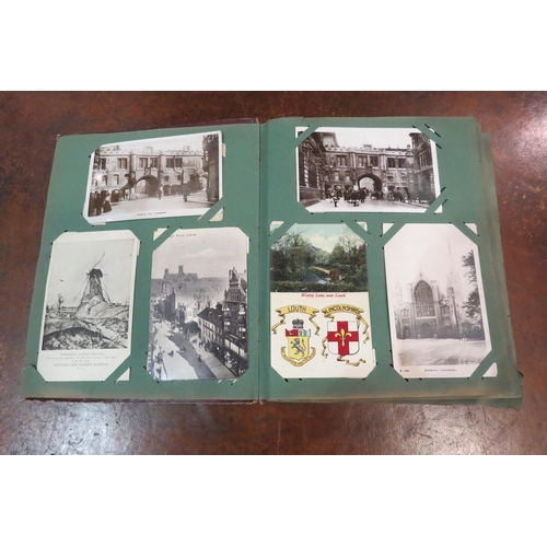 4109 - A postcard album with various contents including topographical, ships and churches