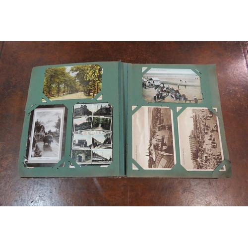 4109 - A postcard album with various contents including topographical, ships and churches