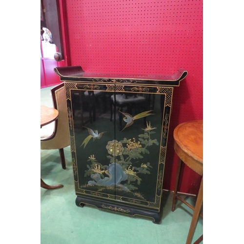 4118 - An Oriental black lacquered effect cabinet with design of Asiatic birds and foliage to front, 102cm ... 