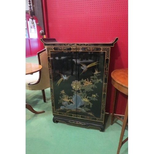 4118 - An Oriental black lacquered effect cabinet with design of Asiatic birds and foliage to front, 102cm ... 