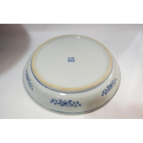 4128 - A modern Chinese blue and white jardiniere, 27cm tall x 35cm diameter, with associated dish (2)