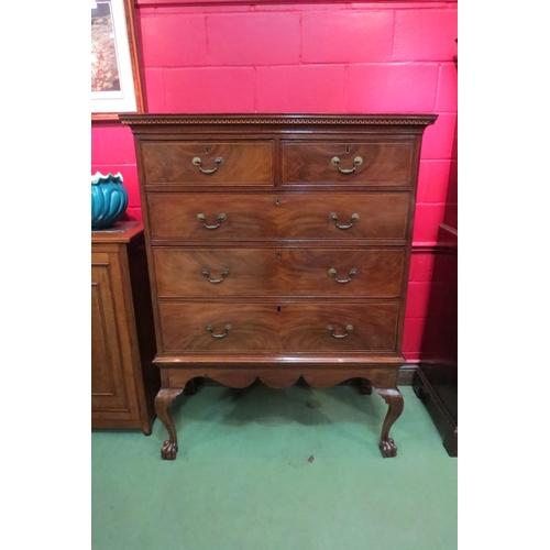 4130 - A Georgian flame mahogany chest on stand with line inlay and satinwood stringing, the Greek key dent... 