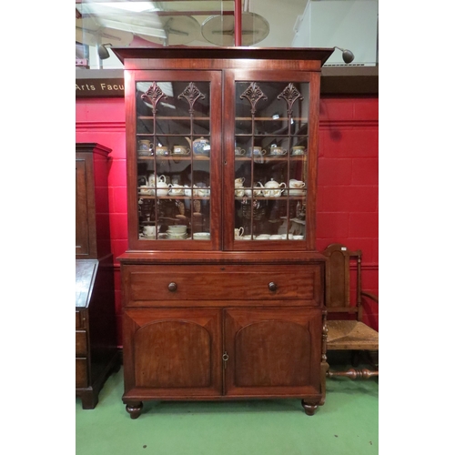 4138 - A Circa 1830 William IV flame mahogany country house bookcase on base, the two glazed doors with car... 