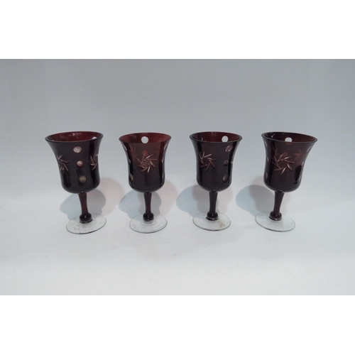 4440 - A Bohemian red glass decanter with four matching glasses