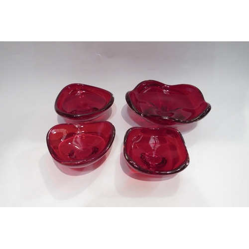 4452 - A Whitefriars ruby red footed dish, 22cm diameter and three similar Whitefriars dishes