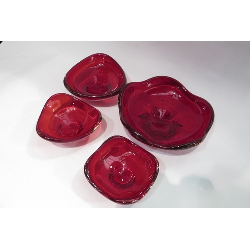 4452 - A Whitefriars ruby red footed dish, 22cm diameter and three similar Whitefriars dishes