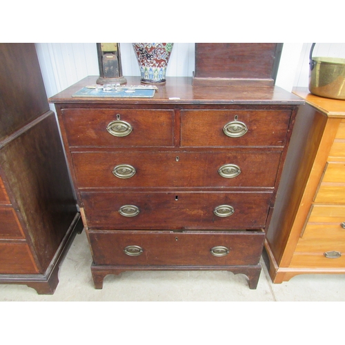 2143 - A George III country oak chest of two short over three long drawers, brass oval handles, on bracket ... 