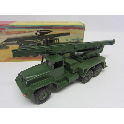 8219 - A boxed Dinky Toys diecast 665 Honest John Missile Launcher with missile