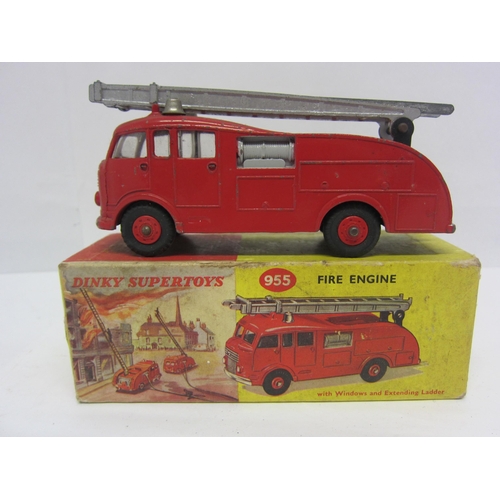 8213 - A boxed Dinky Supertoys diecast 955 Fire Engine with Extending Ladder, finished in red with plastic ... 