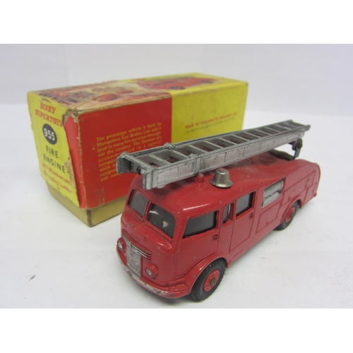 8213 - A boxed Dinky Supertoys diecast 955 Fire Engine with Extending Ladder, finished in red with plastic ... 