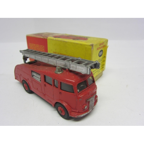 8213 - A boxed Dinky Supertoys diecast 955 Fire Engine with Extending Ladder, finished in red with plastic ... 