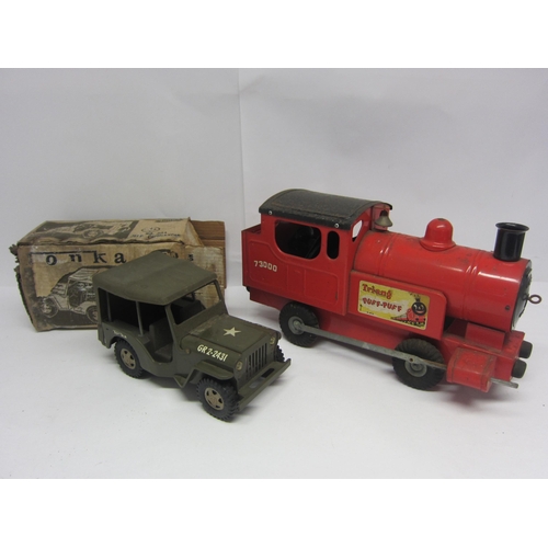 8232 - Two large scale pressed steel model vehicles to include Tonka 304 Jeep Commander with original box (... 