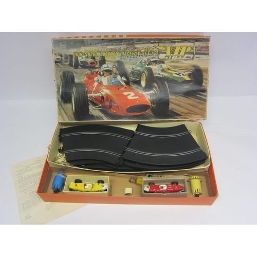 8384 - A VIP Raceways slot racing set FR1100 comprising two Ferrari racing cars, two hand throttles and cur... 