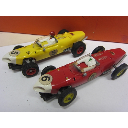 8384 - A VIP Raceways slot racing set FR1100 comprising two Ferrari racing cars, two hand throttles and cur... 