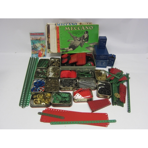 8364 - A collection of mixed loose Meccano components, boxed clockwork and electric motors, instruction boo... 