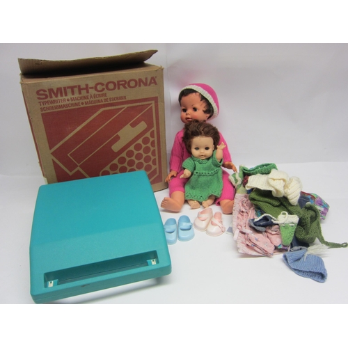 8274 - Two mid 20th Century English soft plastic dolls including Rosebud, a quantity of clothing and a boxe... 