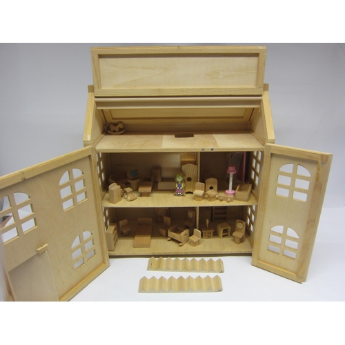 8265 - A two storey wooden dolls house with assorted wooden furniture       (E) £10-20