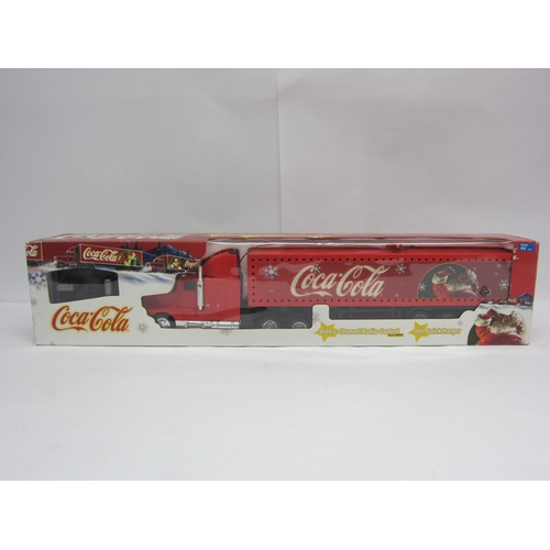 8193 - A boxed radio control Coca-Cola Christmas truck