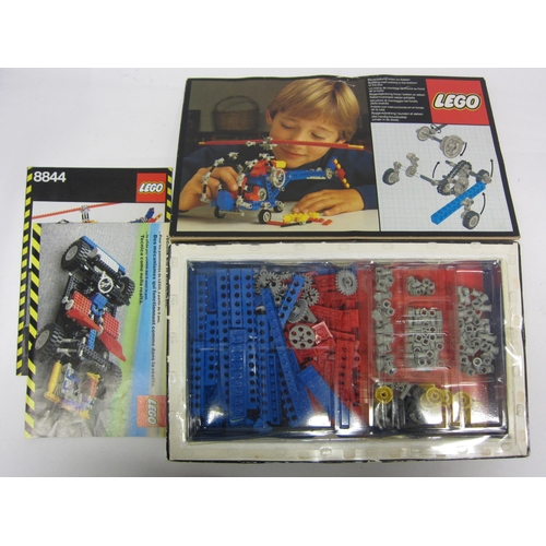 8351 - A boxed Lego set 8844 (contents unchecked) together with a collection of vintage loose Lego bricks a... 