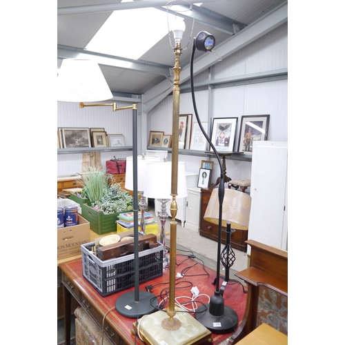 2173 - A brass and onyx standard lamp and a lounge lamp with articulating neck