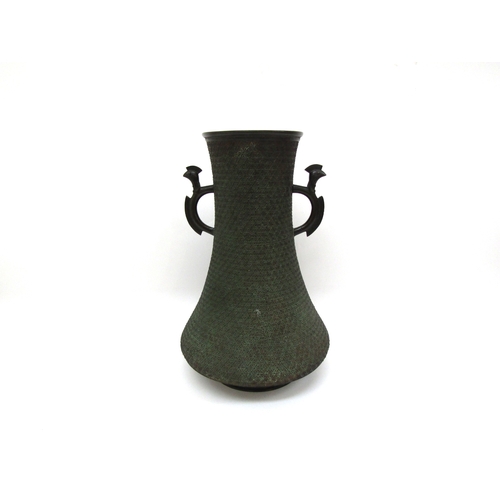 4459 - An Oriental bronze twin-handled vase with applied dragon, signed to base, 31cm tall