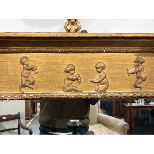 4020A - An early 19th Century ornate gilt gesso frame wall mirror with Corinthian reeded columns and child d... 