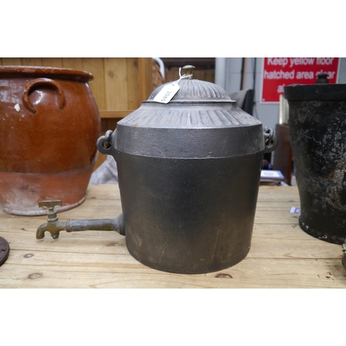 2065 - A cast kettle with long spout and hanging handle, stamped Holcroft & Sons 3 Gallons