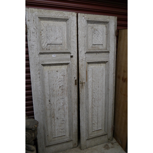 2077 - A pair of oak cupboard doors, 188cm tall x 58cm wide