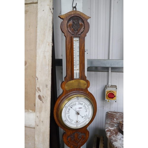 2083 - A carved oak barometer, top a/f