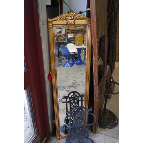 2098 - A 20th Century gold painted wall mirror of slender form