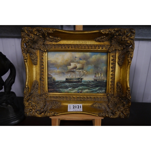 2121 - A small gilt framed oileograph of ships by A. Hulk