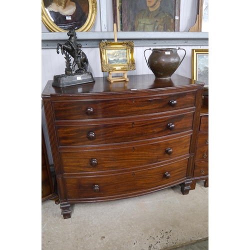 2123 - A Georgian mahogany bow front chest of four drawers