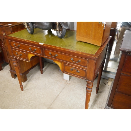 2130 - A mahogany and green leather top four drawer desk