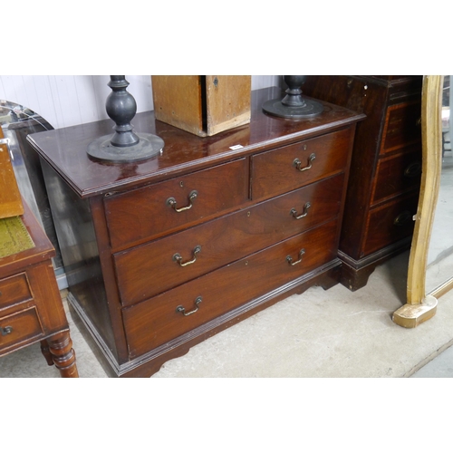 2134 - A Georgian style mahogany chest of two short over two long drawers, swan neck handles, on bracket fe... 