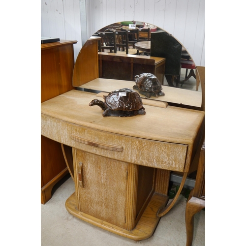 2154 - An Art Deco limted oak dressing table, crescent form mirror over single drawer, single cupboard